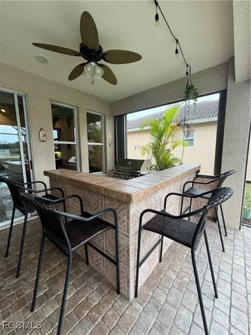 a view of a backyard with sitting area