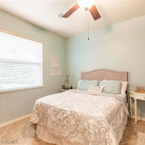 a view of a bed in a bedroom