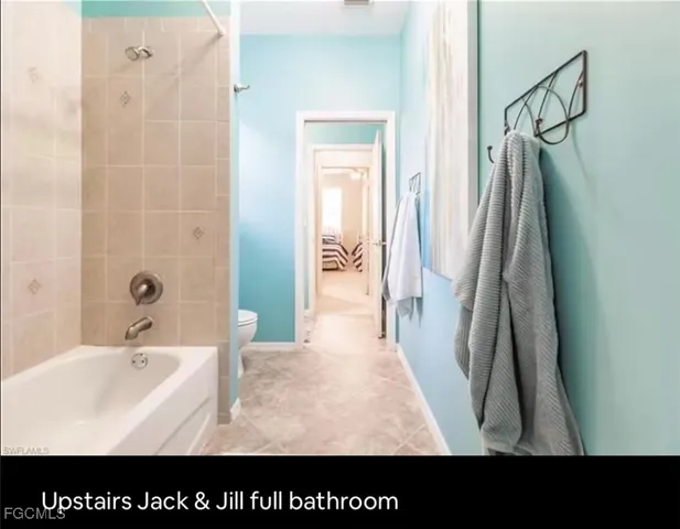 a view of storage and utility room with washer and dryer