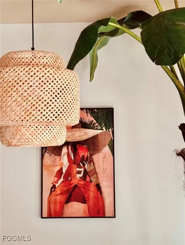 a dining room with furniture and a potted plant
