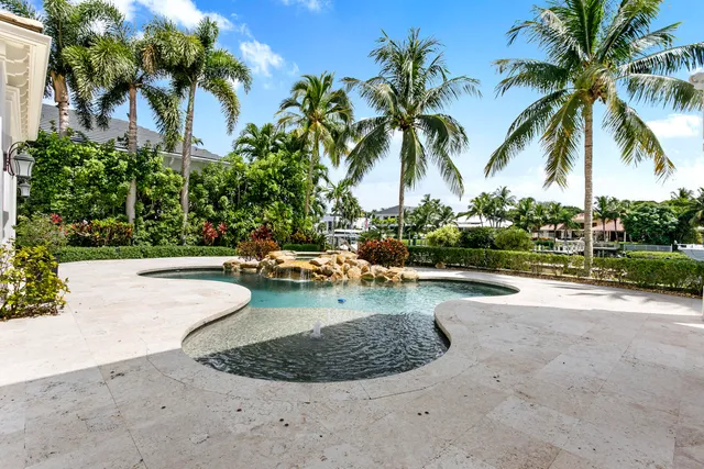 an aerial view of a house with a ocean view