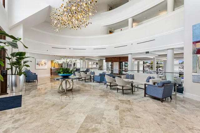 a very nice looking dining room with a large dining table and a chairs with the potted plants