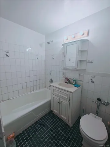 a bathroom with a sink a toilet and bathtub