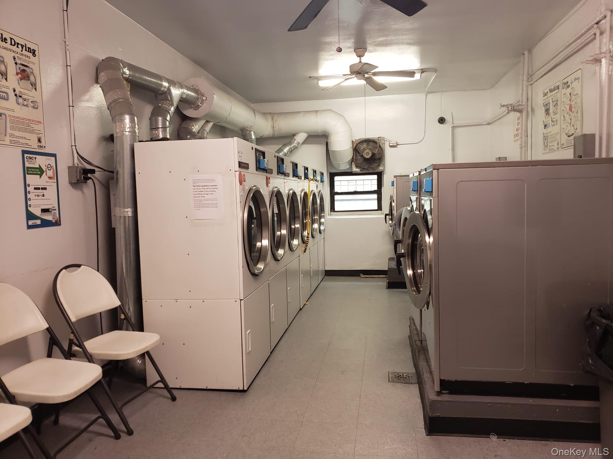 41-31 51st Street, Unit 6M Queens, NY 11377 - Photo 22 of 23 Clothes washing area with ceiling fan and independent washer and dryer