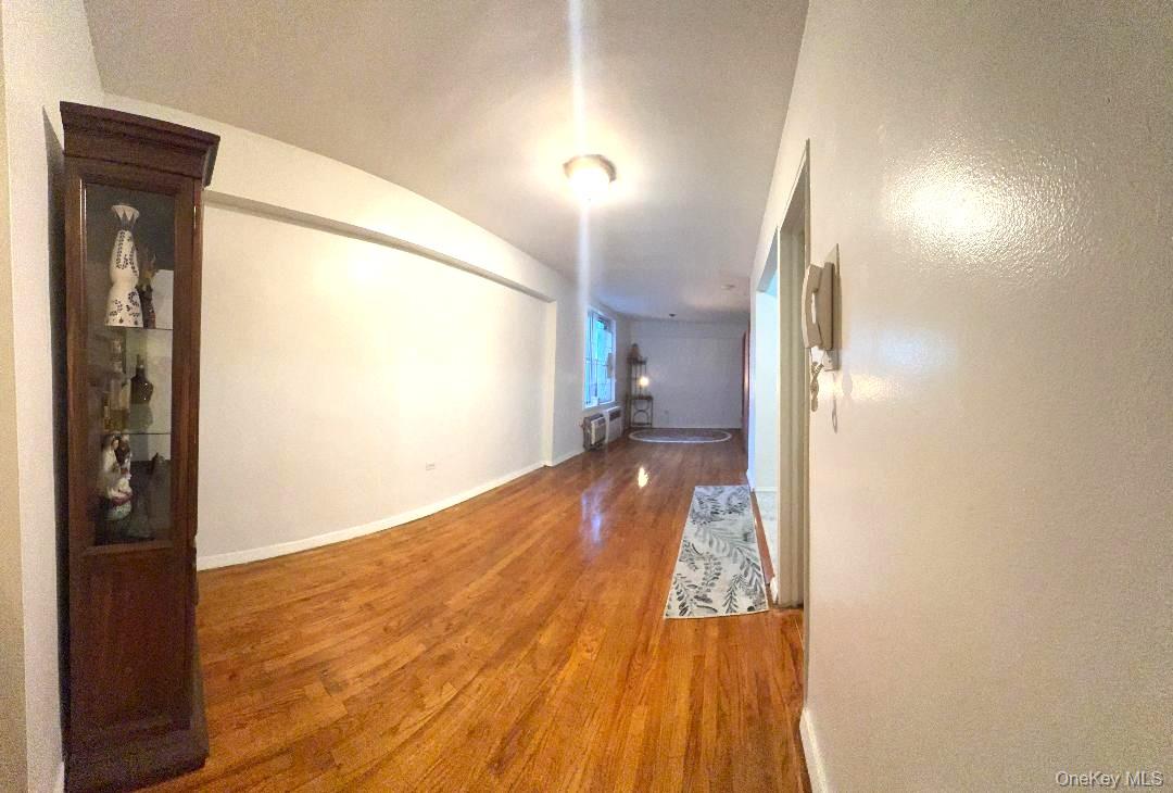 41-31 51st Street, Unit 6M Queens, NY 11377 - Photo 4 of 23 Hallway with wood finished floors and baseboards