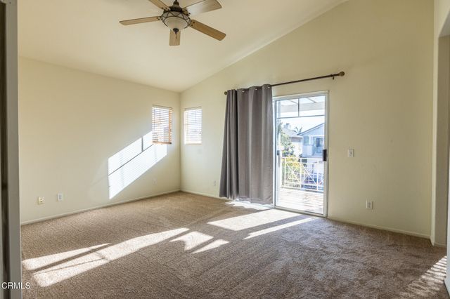a view of livingroom with window and a ceiling fan