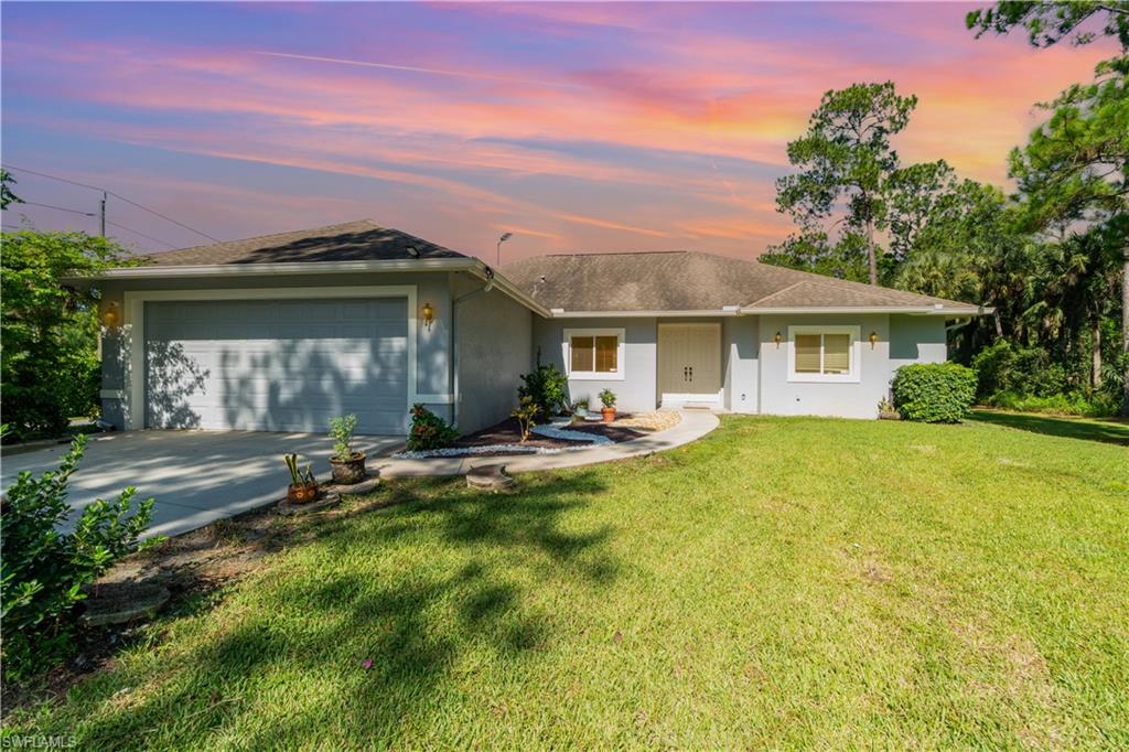 a view of a house with pool and chairs