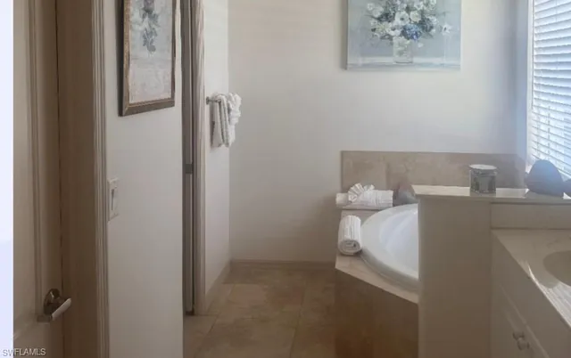 a room with a white wall and a window