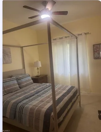 a bedroom with a bed and a shower