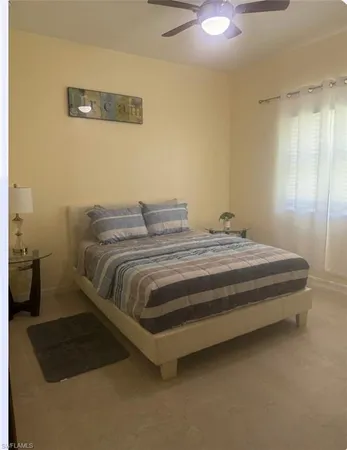a bedroom with a bed and a cabinets