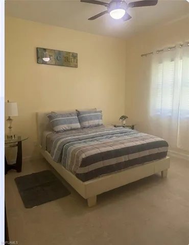 a bedroom with a bed and a cabinets