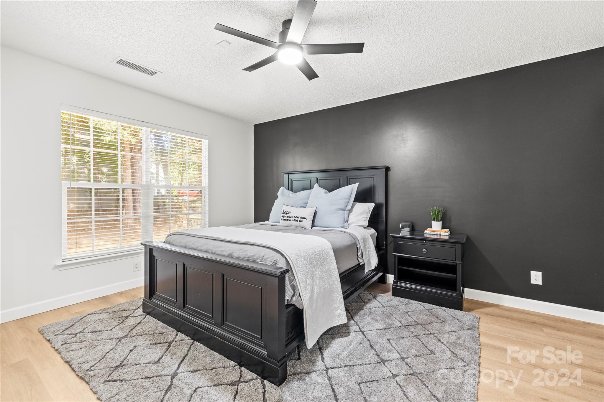 4909 Deerton Road Charlotte, NC 28269 - Photo 14 of 31 a bedroom with a bed and a window