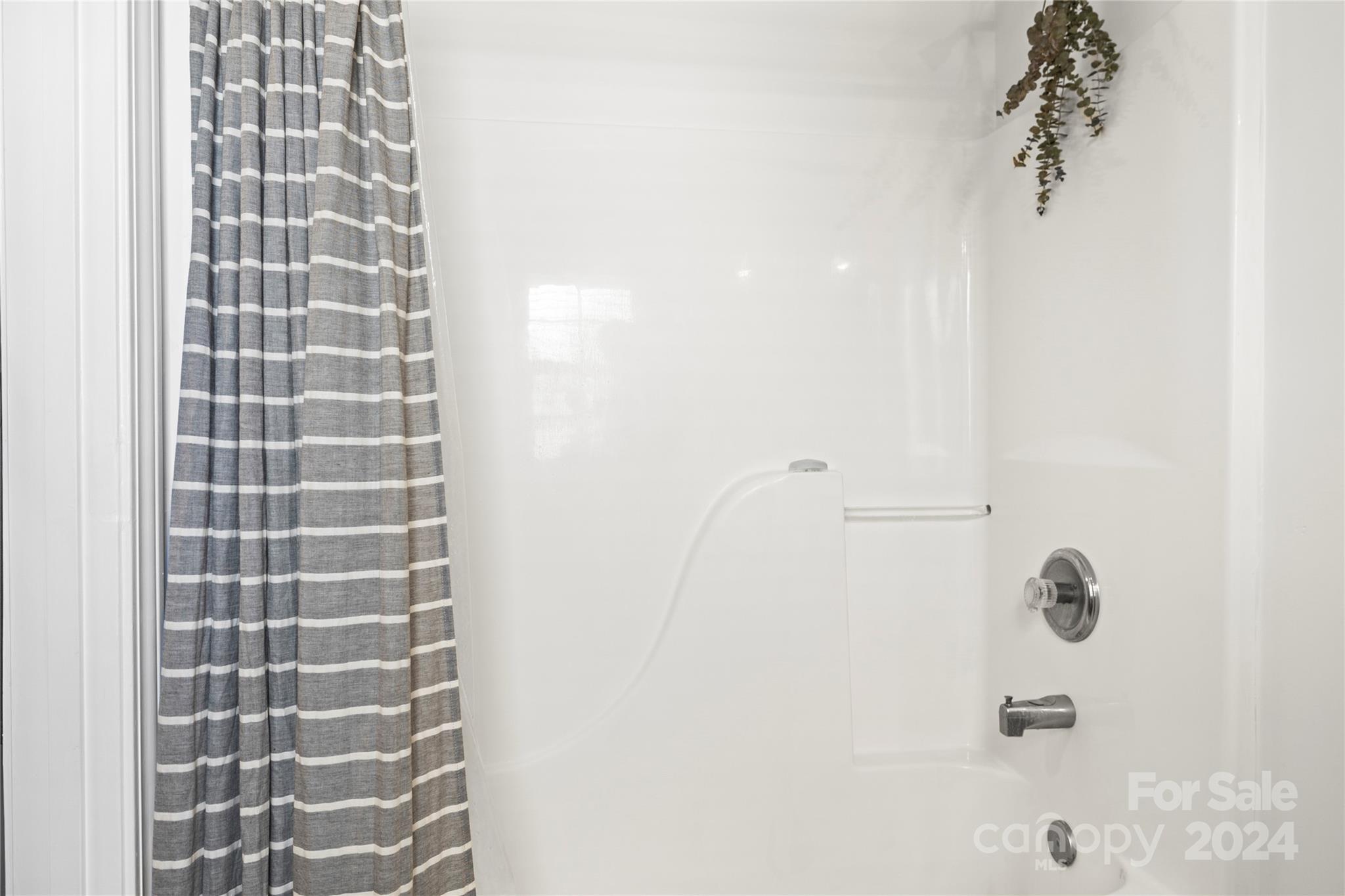 4909 Deerton Road Charlotte, NC 28269 - Photo 16 of 31 a bathroom with a shower