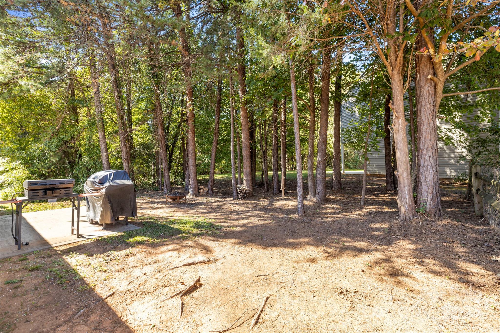 4909 Deerton Road Charlotte, NC 28269 - Photo 27 of 31 a backyard of a house with table and chairs