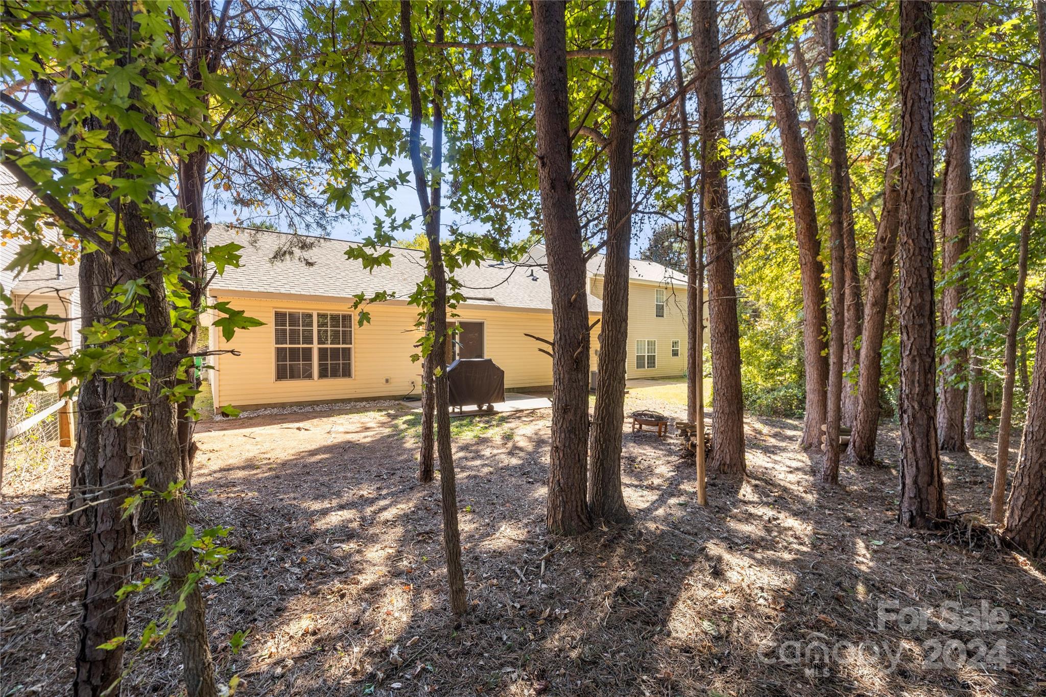 4909 Deerton Road Charlotte, NC 28269 - Photo 29 of 31 a view of a yard with a tree