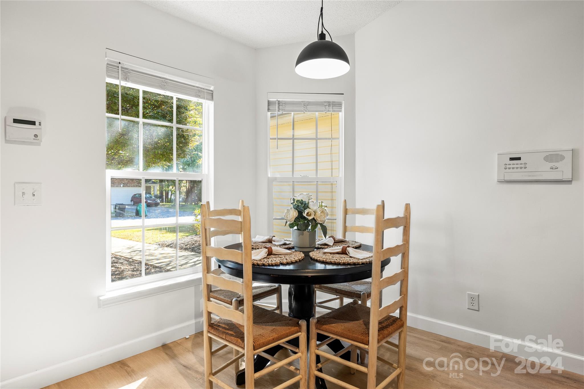 4909 Deerton Road Charlotte, NC 28269 - Photo 5 of 31 a view of a dining room with furniture window and outside view