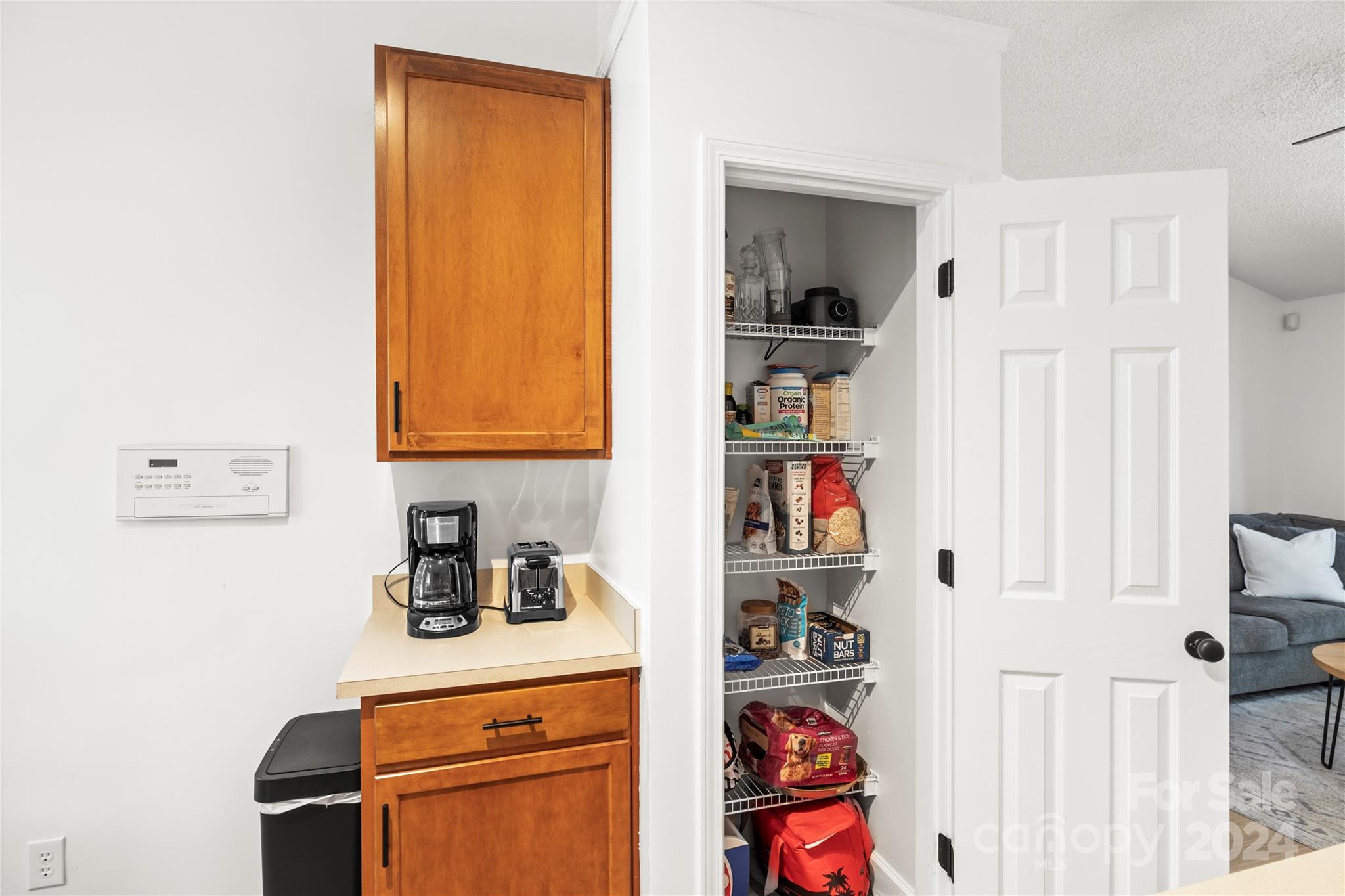4909 Deerton Road Charlotte, NC 28269 - Photo 7 of 31 a kitchen with a refrigerator and cabinets