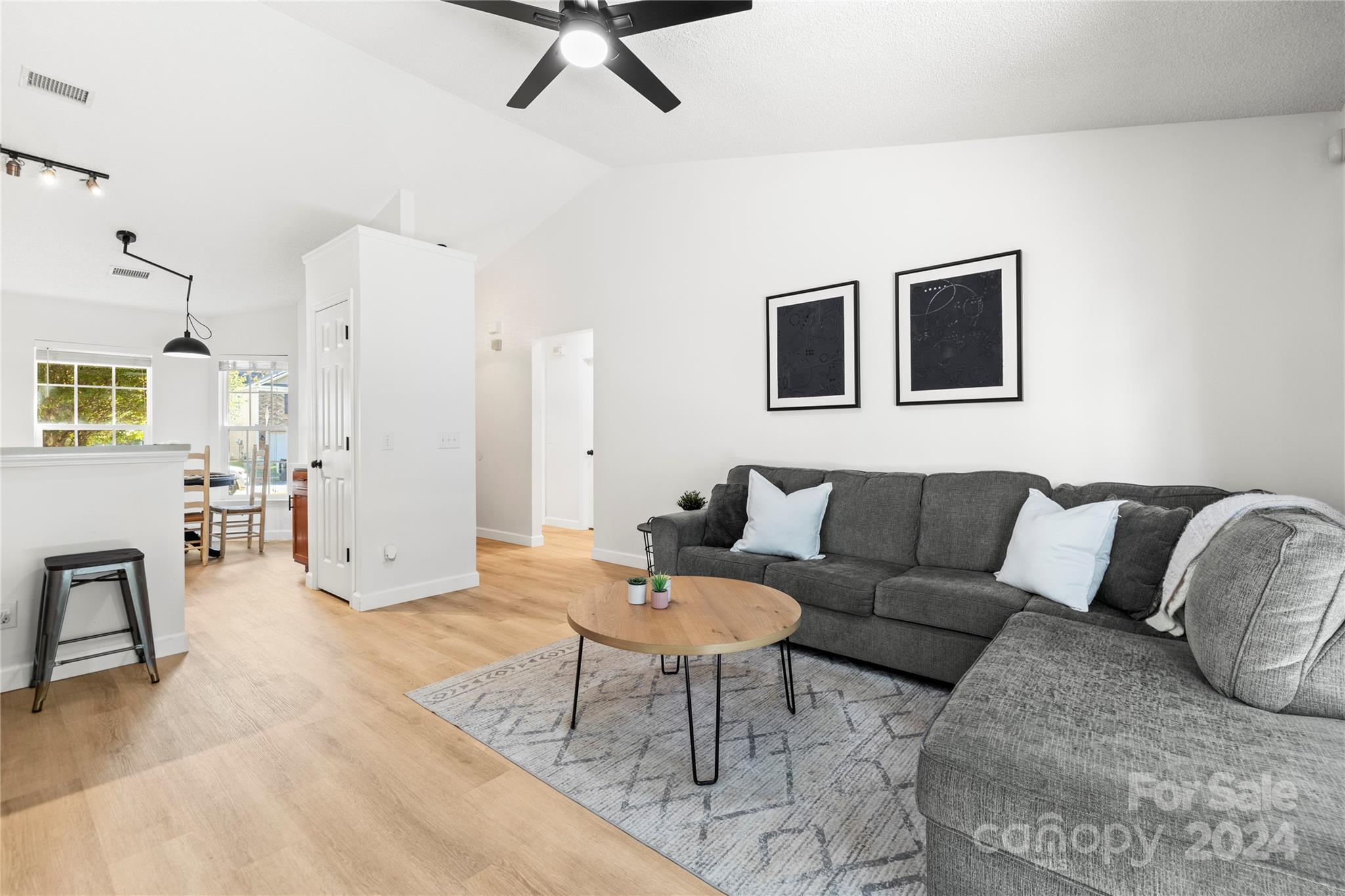 4909 Deerton Road Charlotte, NC 28269 - Photo 9 of 31 a living room with furniture and a table