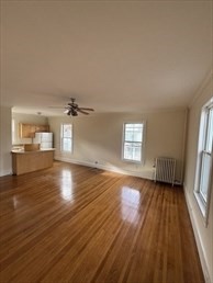 14 Church Avenue, Unit 2A Woburn, MA 01801 - Photo 2 of 5 wooden floor in an empty room with a window
