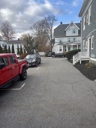 14 Church Avenue, Unit 2A Woburn, MA 01801 - Photo 5 of 5 a view of a car park in front of a building