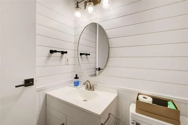 a bathroom with a sink and mirror