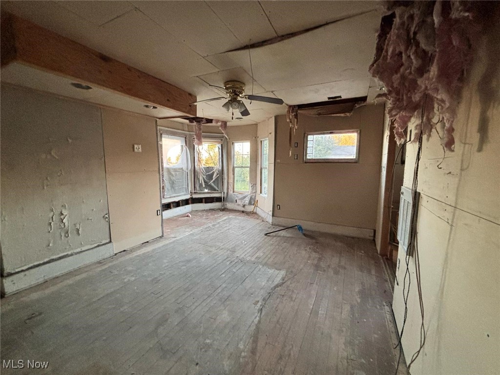 1888 Beersford Road Cleveland, OH 44112 - Photo 8 of 22 Bedroom with wood-type flooring and a ceiling fan