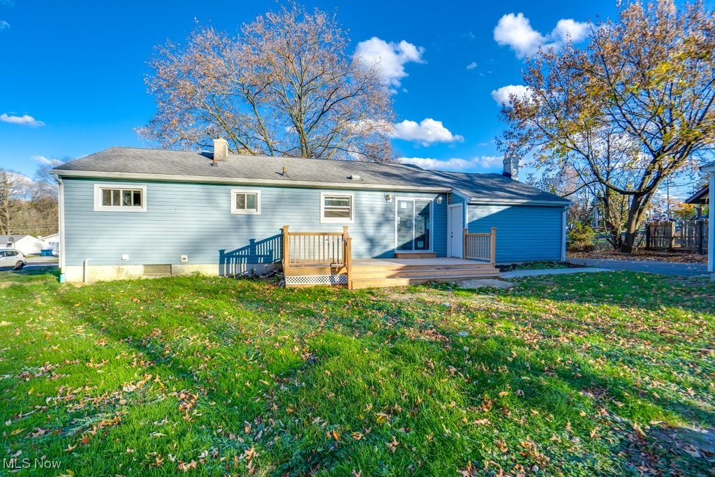 3720 Baird Road Stow, OH 44224 - Photo 41 of 45 Rear view of house with a yard and a deck