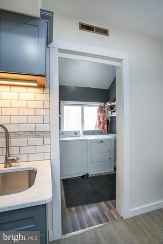 a white toilet sitting next to a bathroom sink