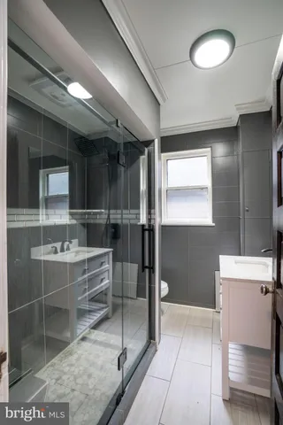 a view of a room with wooden floor and windows