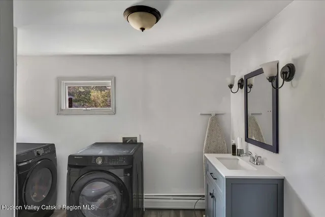 a bathroom with a sink and a washing machine