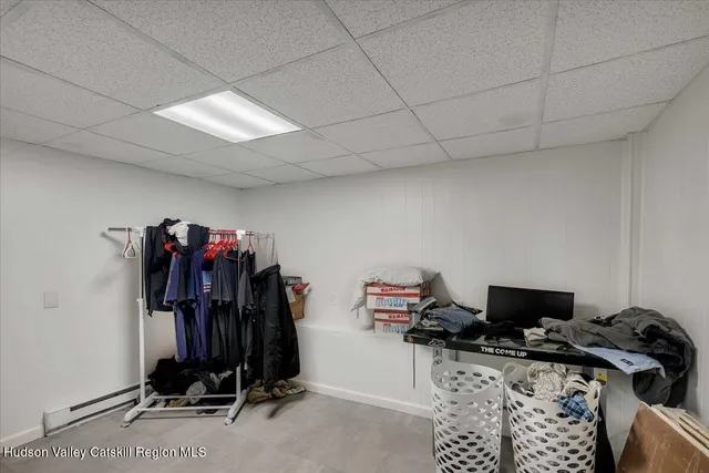 a view of walk in closet with clothes
