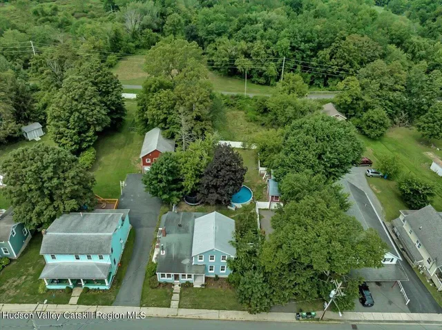 an aerial view of a house with outdoor space