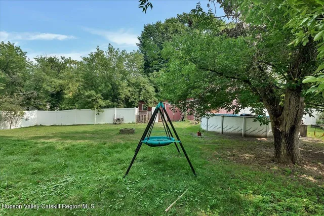 a view of a backyard with a slide