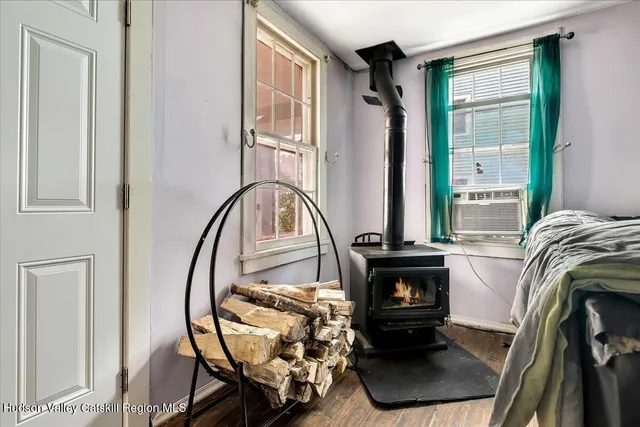 a view of living room with furniture and a fireplace