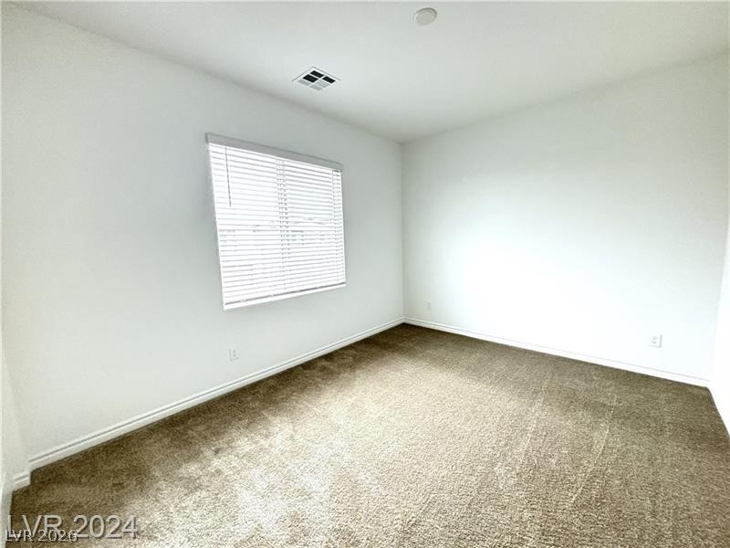 8336 Rowan Rdg Avenue Las Vegas, NV 89147 - Photo 11 of 15 An inviting room awaits your personal touch, offering comfort and style.