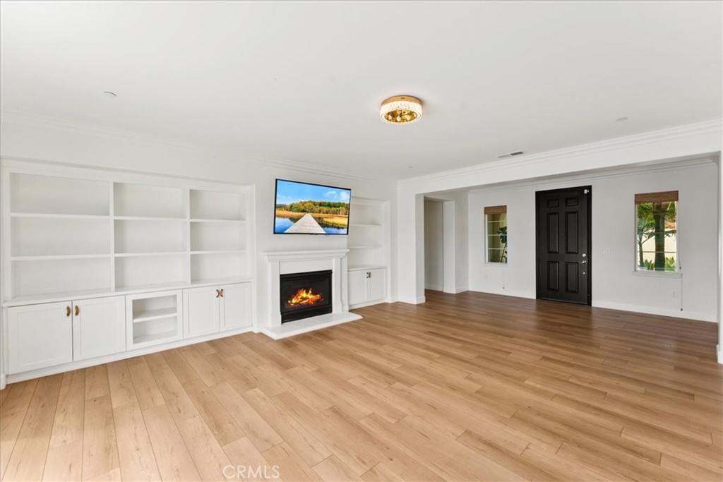 2836 Mesa Grove Road Fallbrook, CA 92028 - Photo 14 of 54 a view of an empty room with a fireplace and a window