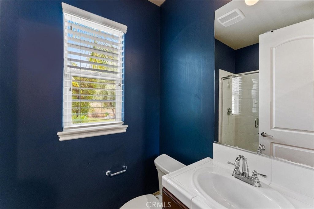 2836 Mesa Grove Road Fallbrook, CA 92028 - Photo 30 of 54 a bathroom with a sink vanity mirror and toilet