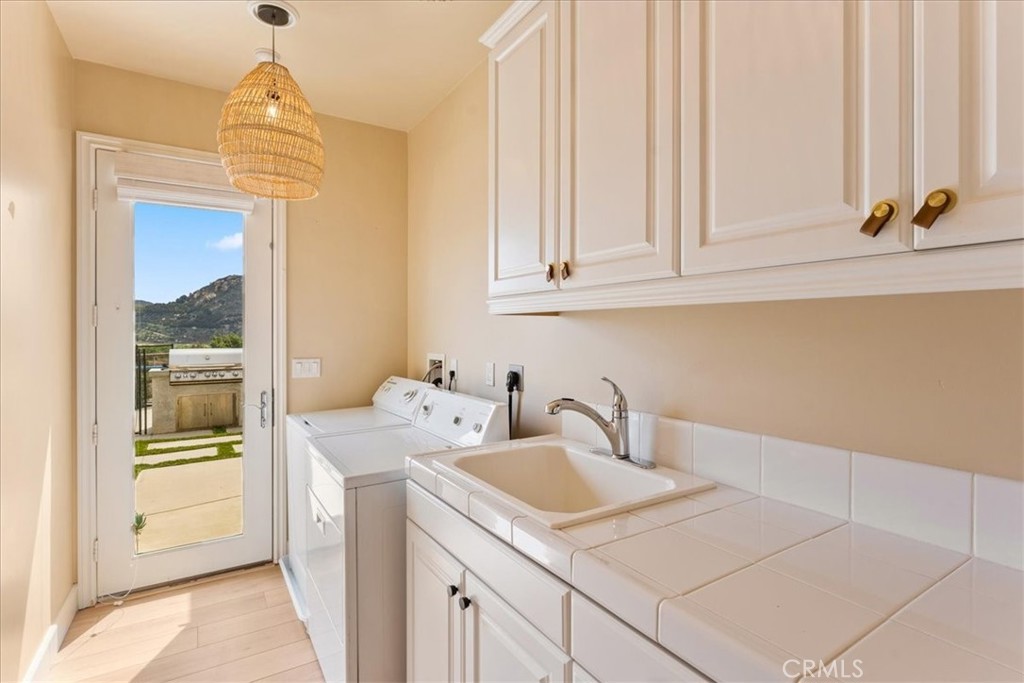 2836 Mesa Grove Road Fallbrook, CA 92028 - Photo 36 of 54 a bathroom with a sink and a mirror