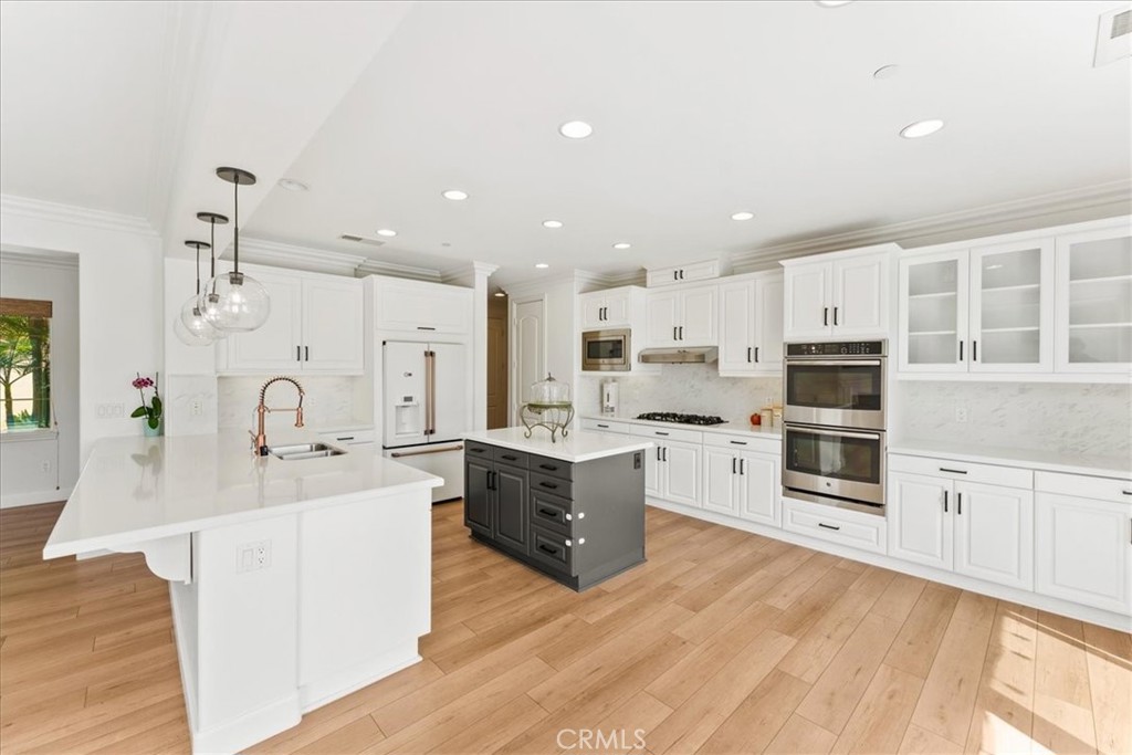 2836 Mesa Grove Road Fallbrook, CA 92028 - Photo 4 of 54 a large kitchen with stainless steel appliances kitchen island granite countertop a large counter top and sink