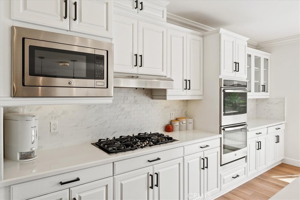 2836 Mesa Grove Road Fallbrook, CA 92028 - Photo 8 of 54 a kitchen with white cabinets and white appliances