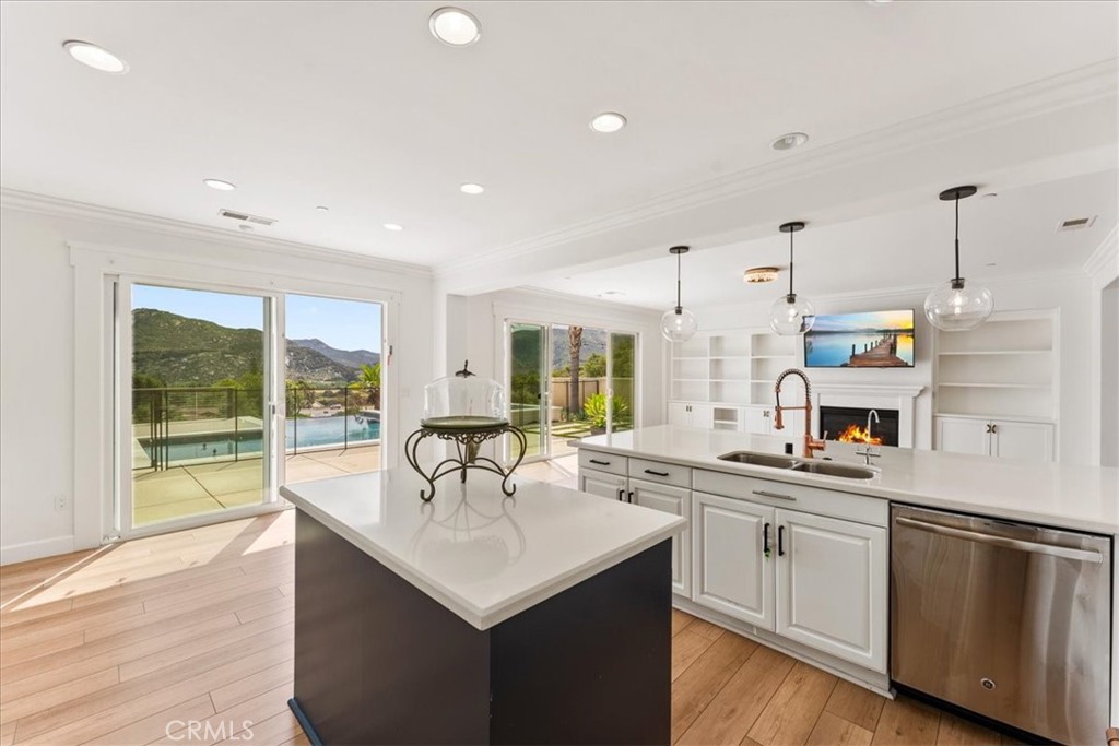 2836 Mesa Grove Road Fallbrook, CA 92028 - Photo 9 of 54 a kitchen with stainless steel appliances a sink stove and cabinets