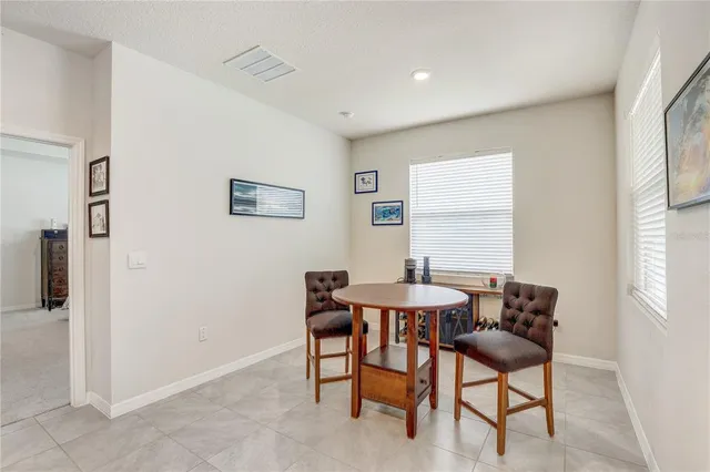 a bedroom with a bed and a night stand