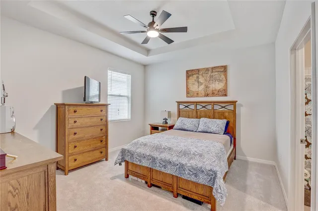 a bedroom with a bed and a dresser