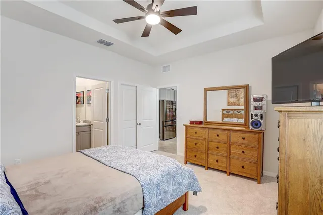 a bedroom with a bed and a dresser