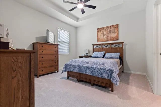 a bathroom with a sink a toilet a mirror and shower curtain