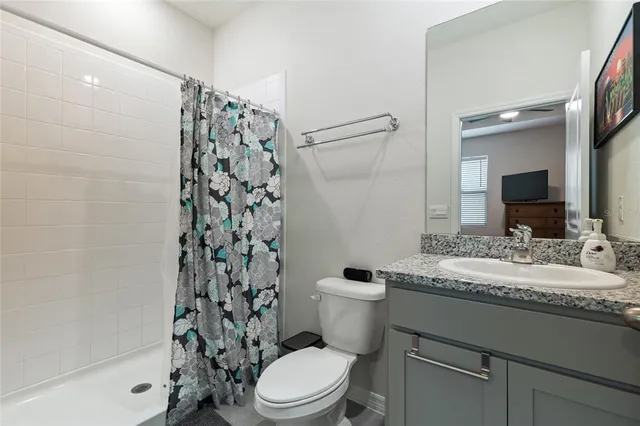 a view of a house with backyard and porch