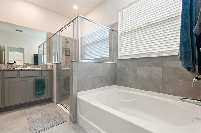 a bathroom with a bathtub and a sink