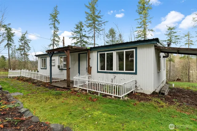 a house with trees in the background