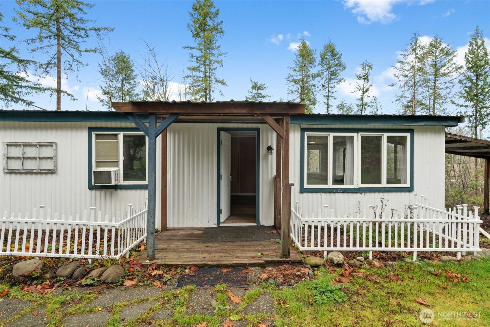 18818 Slough Lane Southeast Yelm, WA 98597 - Photo 3 of 39 a front view of a house with a garden