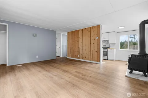 a view of a livingroom with furniture and wooden floor